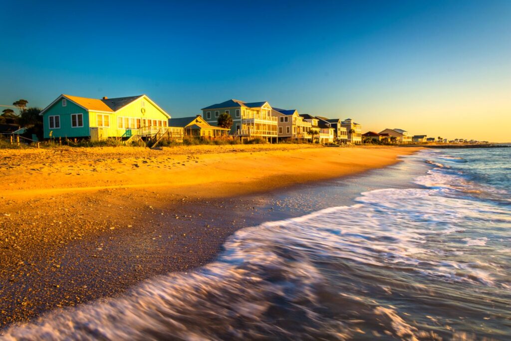 Oceanfront beach houses along Edisto Beach at sunset