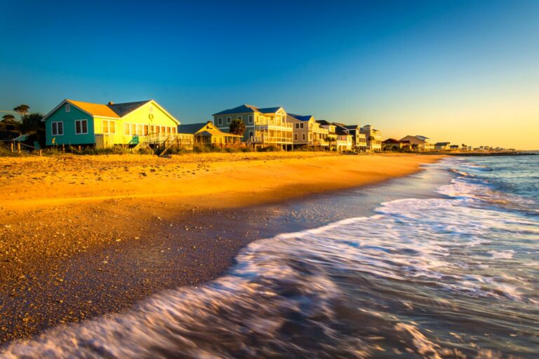 Oceanfront beach houses along Edisto Beach at sunset