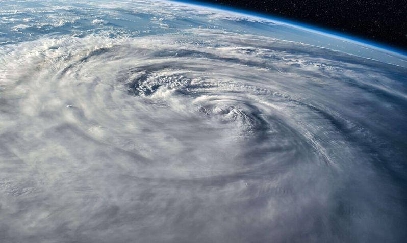 Satellite view of a hurricane spiraling over the Atlantic